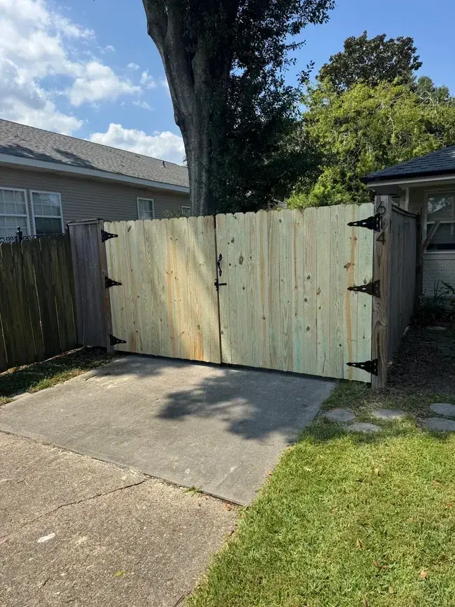 Double wood gate under oak tree
