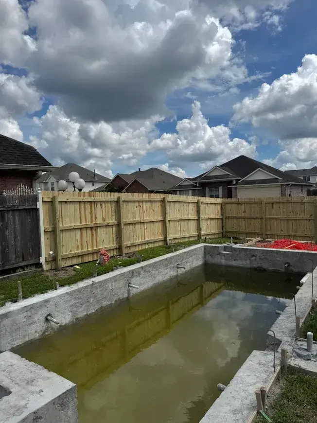 New pool and fence under construction
