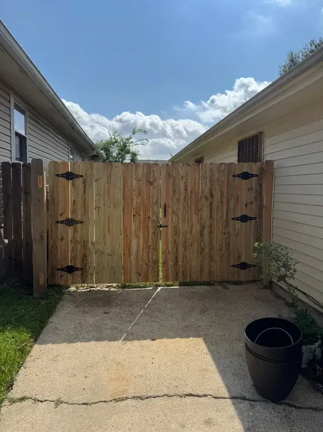 Wood gate with iron hinges