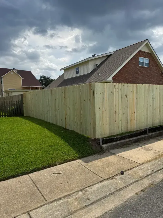 Wood fence against dramatic sky